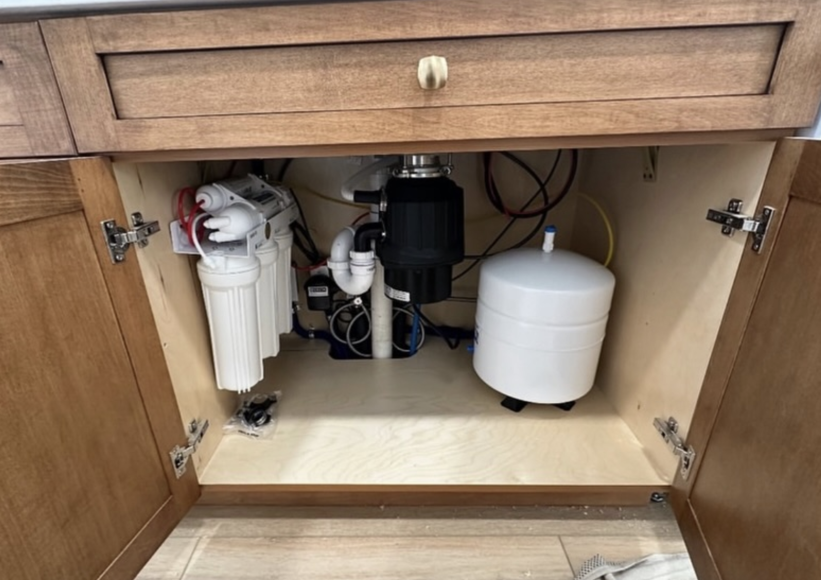 Under-sink reverse osmosis install by Zollinger Construction in Sayreville, NJ