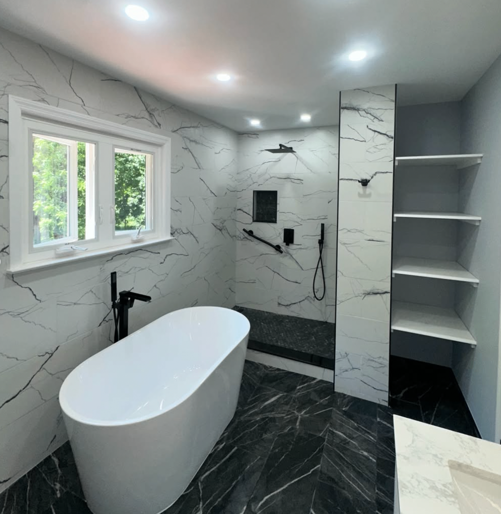 Freestanding tub and walk-in shower by Zollinger Construction in Aberdeen, NJ