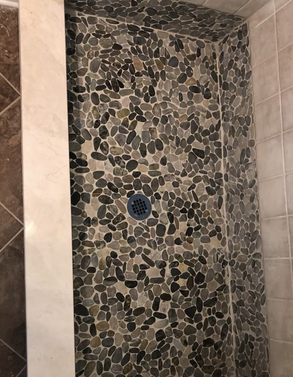 Pebble-stone shower floor by Zollinger Construction in Perth Amboy, NJ