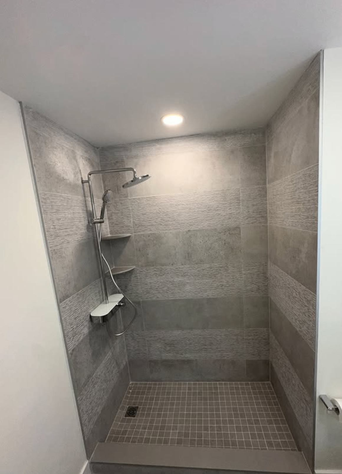 Wide grey tile shower by Zollinger Construction in Old Bridge, NJ