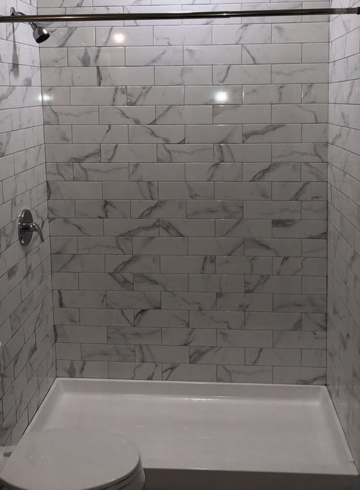Marble subway tile tub surround by Zollinger Construction in Cheesequake, NJ