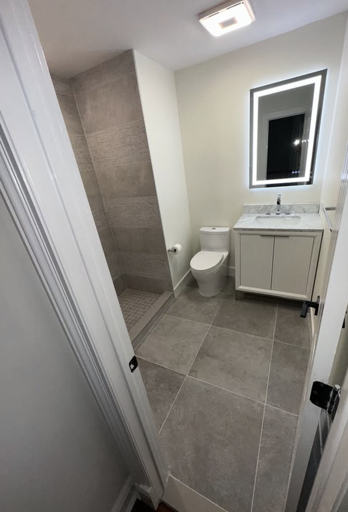Compact walk-in shower and vanity by Zollinger Construction in South Amboy, NJ