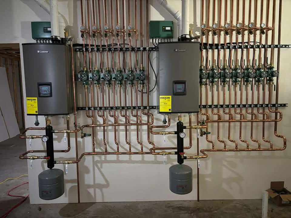 Professional Lochinvar boiler installation with copper manifold piping