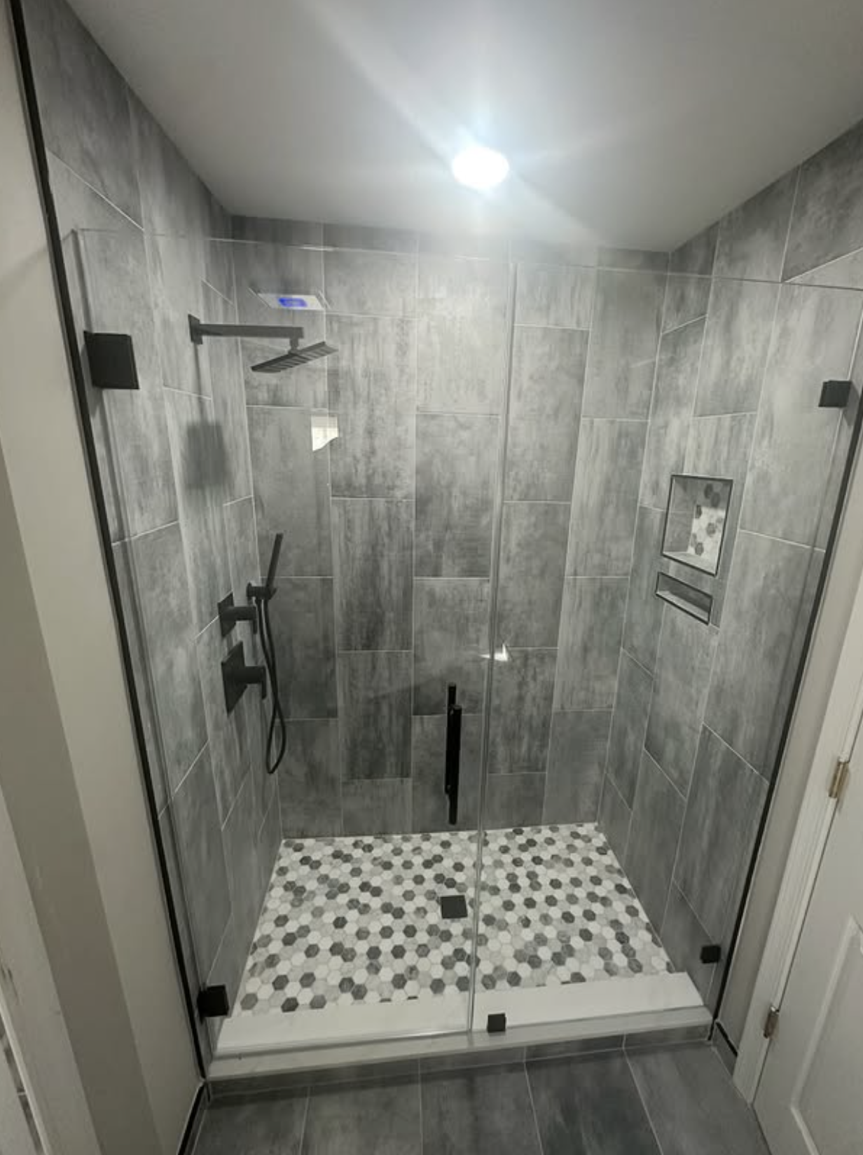 Slate walk-in shower by Zollinger Construction in Old Bridge, NJ