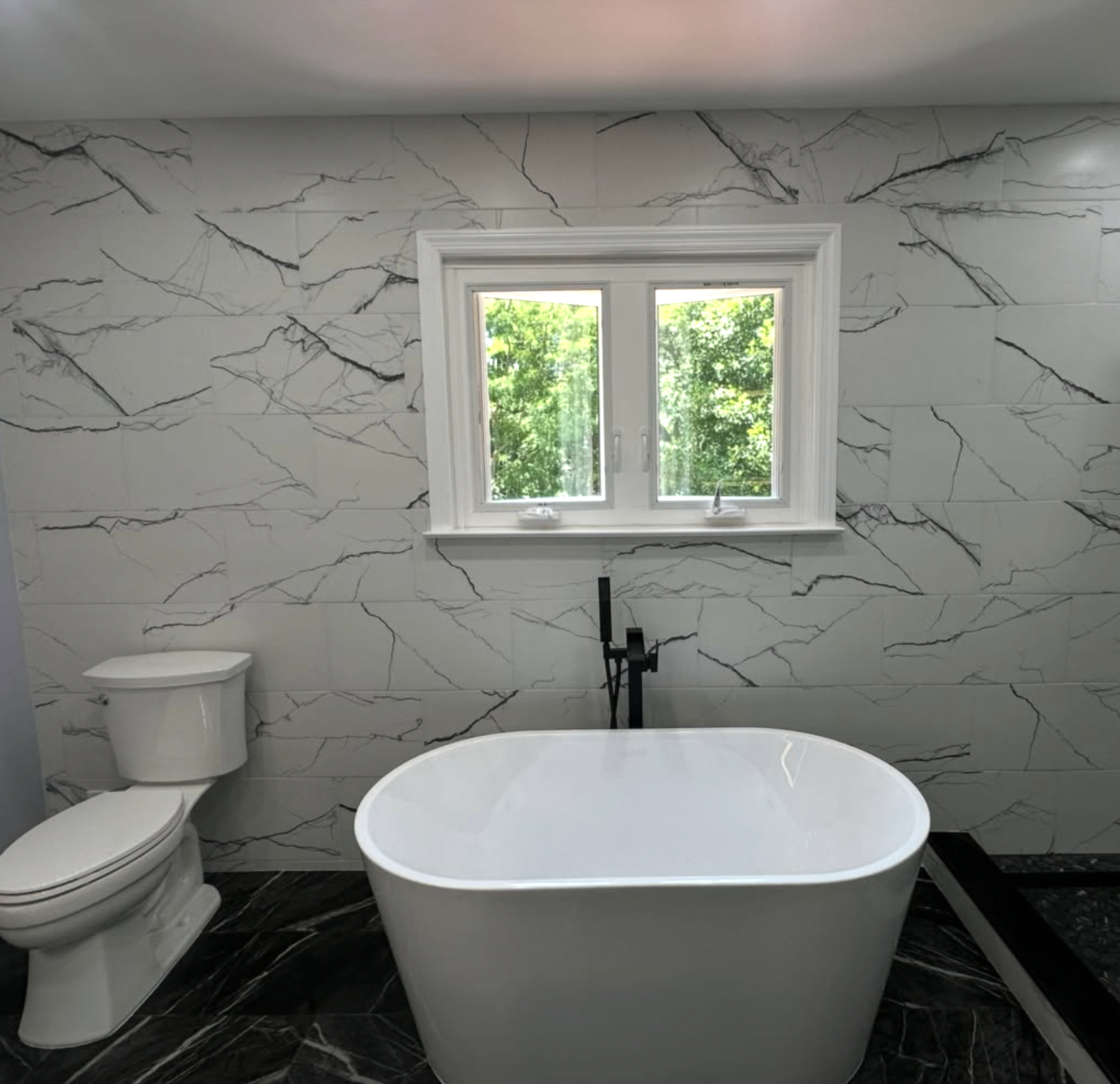 Marble-look master bath by Zollinger Construction in Matawan, NJ