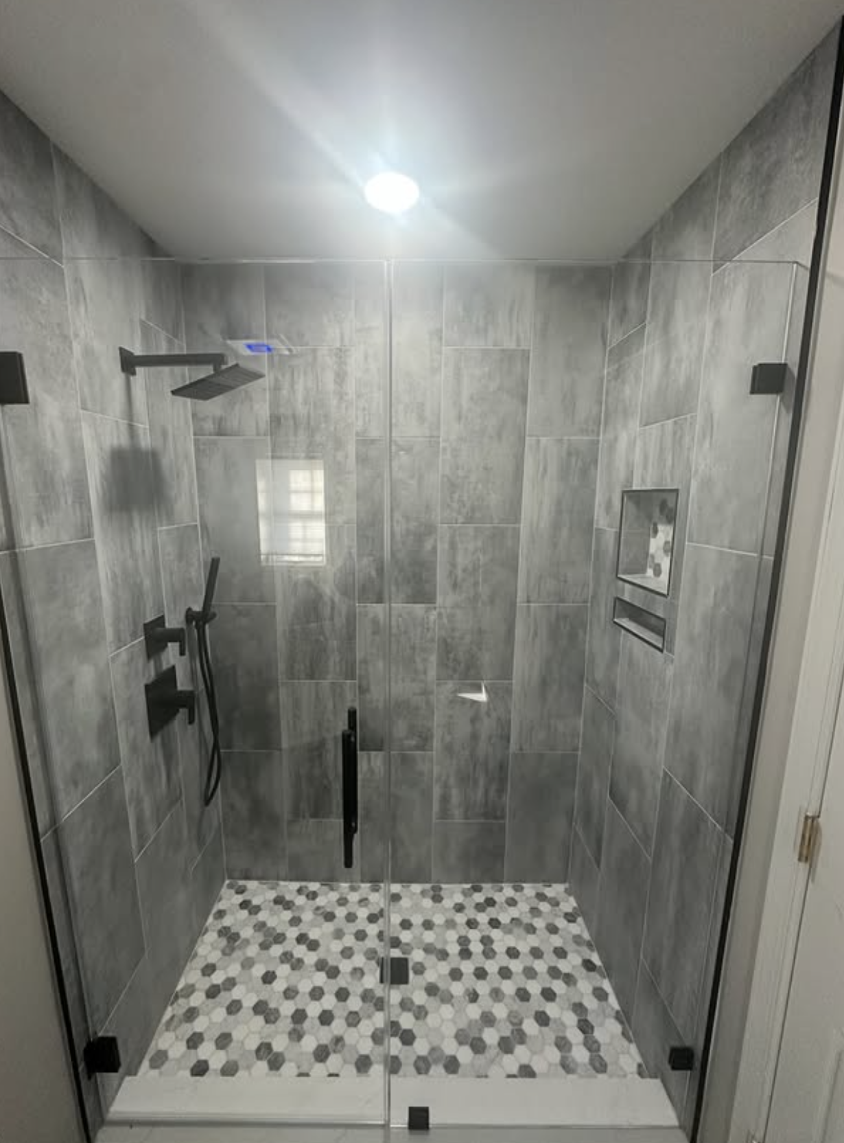 Glass-enclosed shower by Zollinger Construction in South Amboy, NJ