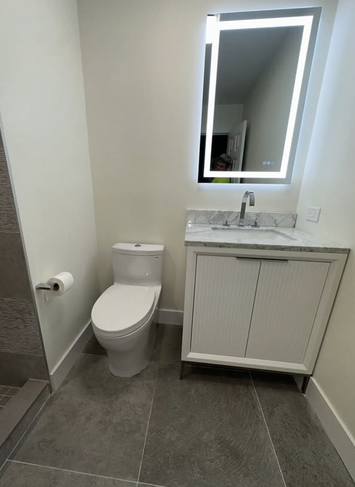 Powder room with LED mirror by Zollinger Construction in South River, NJ