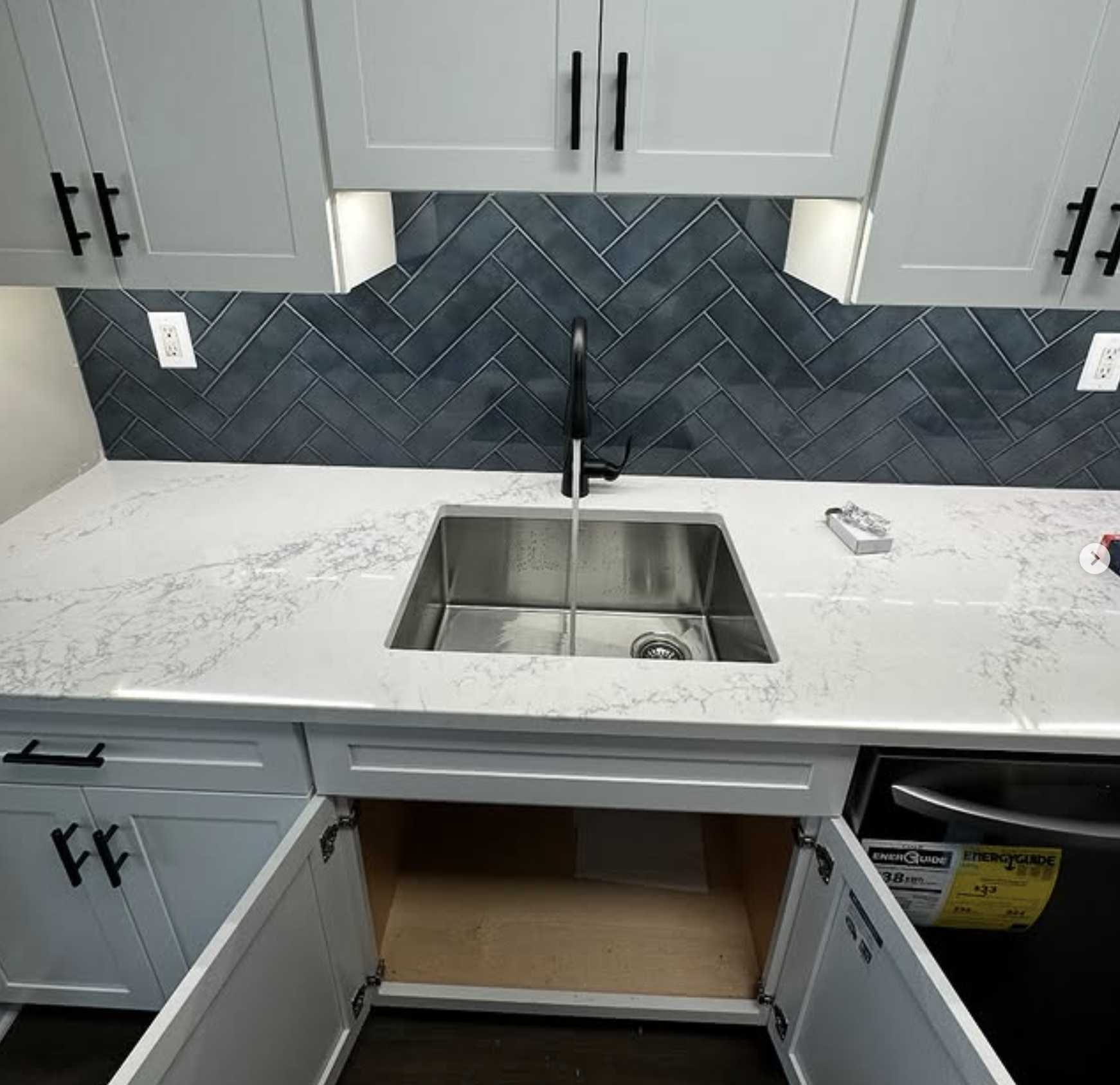 Kitchen remodel with herringbone backsplash and quartz counters in South Amboy, NJ