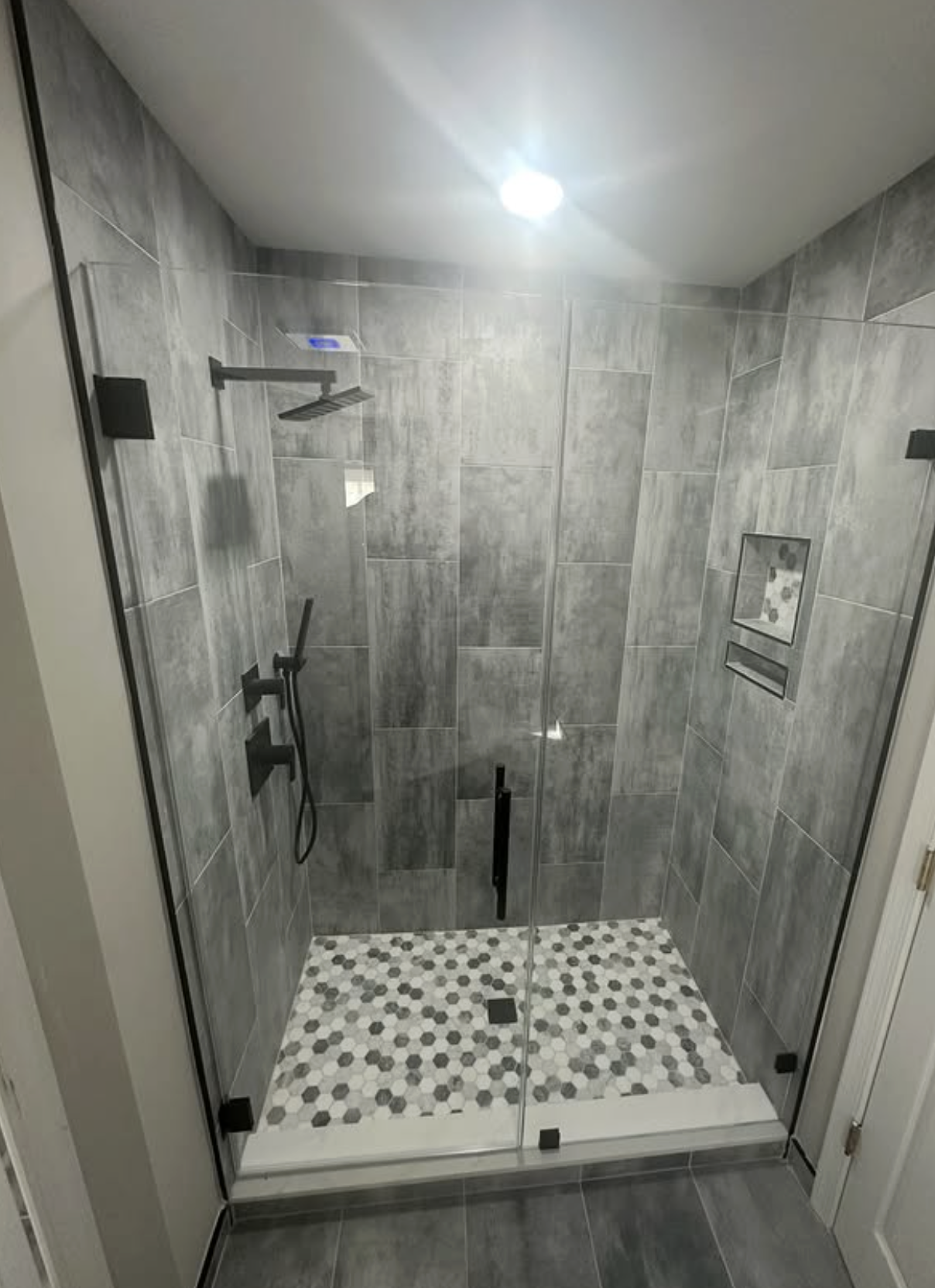 Slate-tile walk-in shower by Zollinger Construction in Matawan, NJ